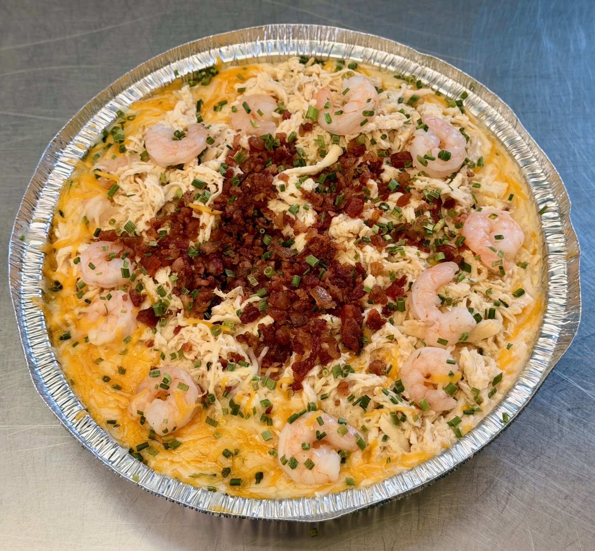 A CHUBBYS shrimp and Alfredo loaded potato